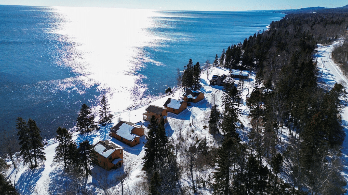 Aerial view of Ours Resort cabins along the Lake Superior shoreline in Lutsen, Minnesota in winter