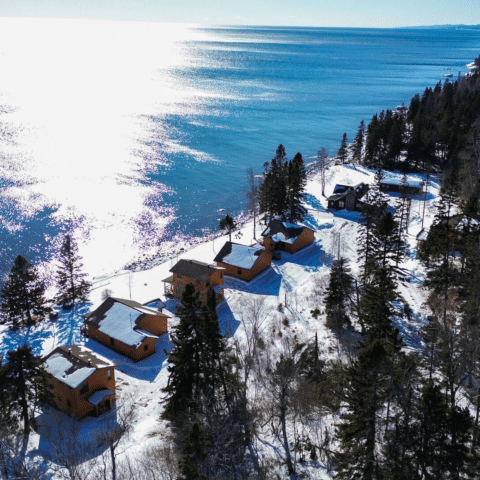 Aerial view of Ours Resort cabins along the Lake Superior shoreline in Lutsen, Minnesota in winter